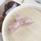 Beau sweet bow shaped hair claw clip shown from angled front view