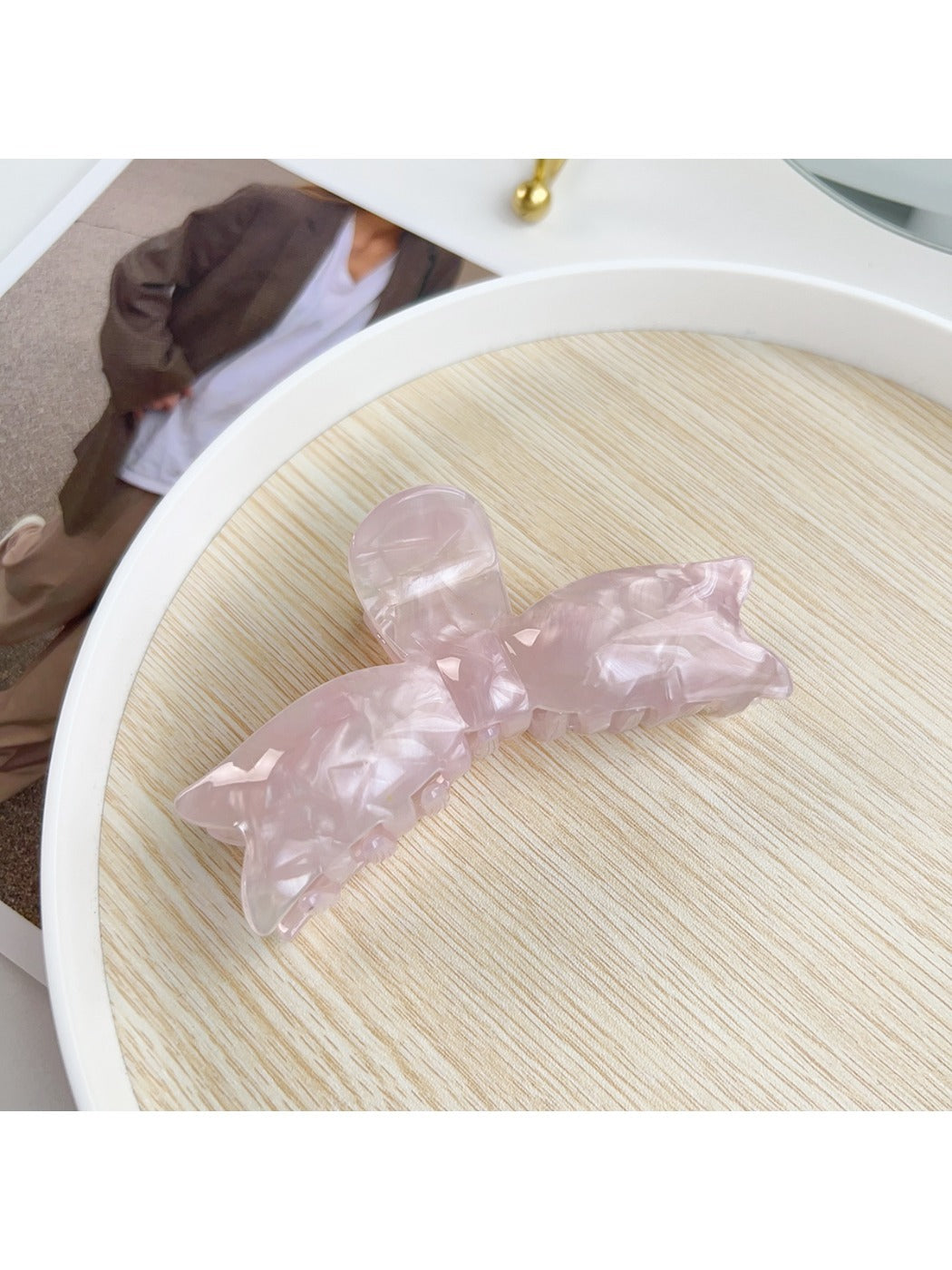 Beau sweet bow shaped hair claw clip shown from angled front view