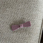 Beau pink polka dot claw clip held in hand showing size and grip