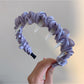 Gifty twist headband worn with ponytail hairstyle