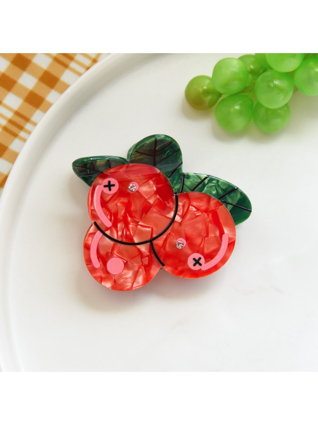 Side view of the fruit shaped hair clip showing the clip mechanism