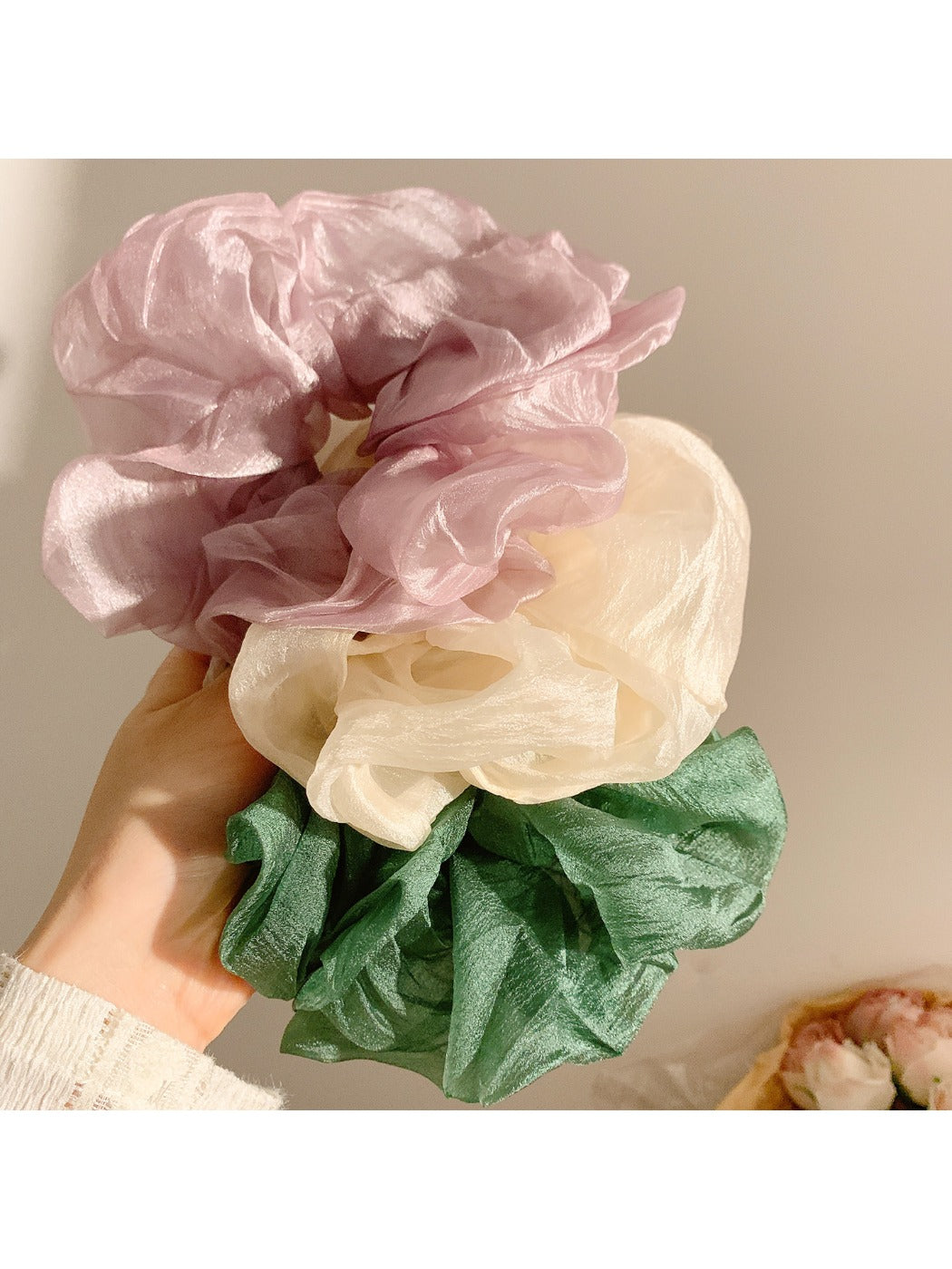 Gifty scrunchie displayed on a white background showing its texture and color