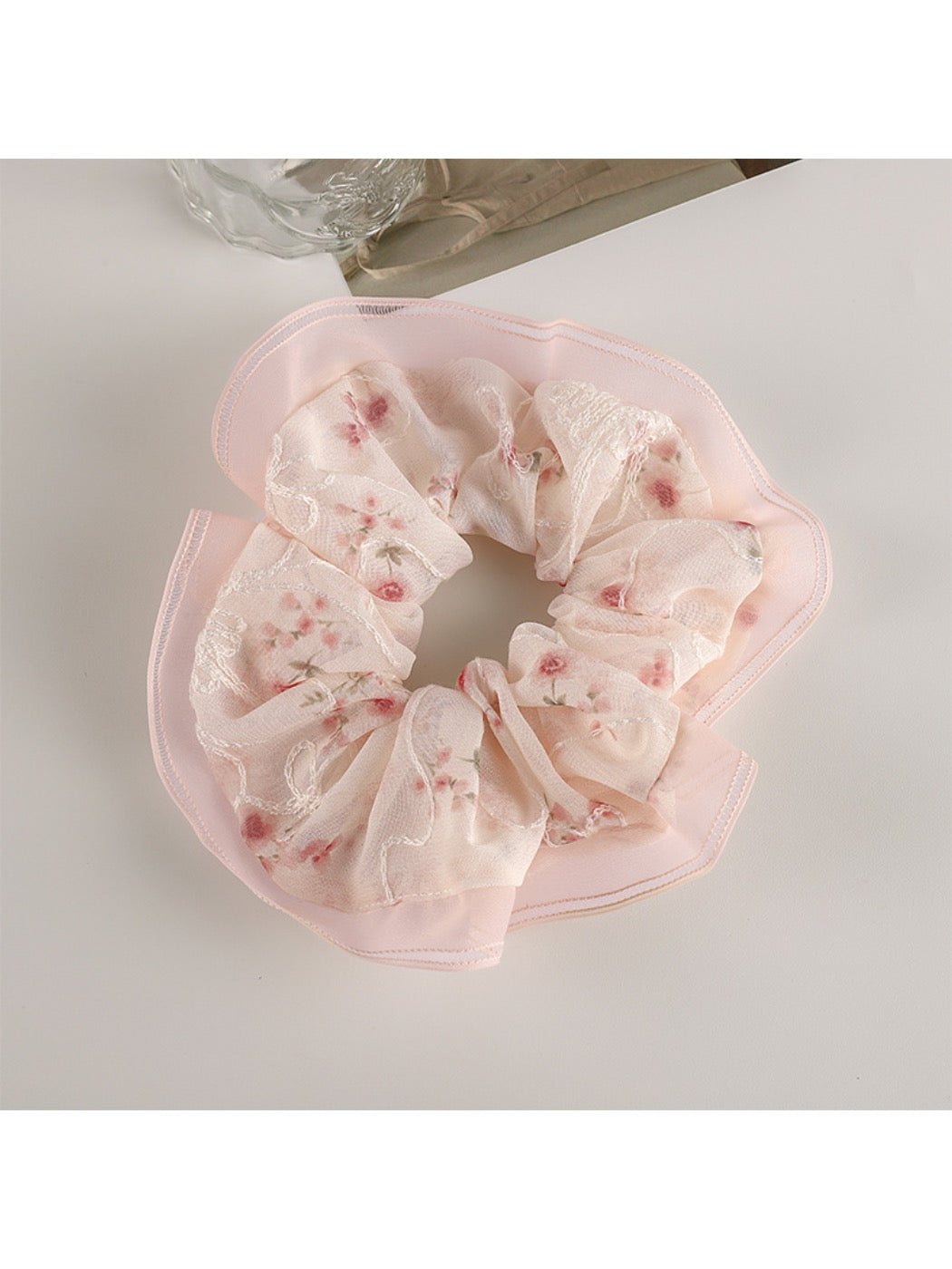 Gifty Sweet Graceful Floral Scrunchie styled in a ponytail on a model with brown hair