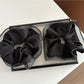 Close-up of Gifty minimalist scrunchie showing smooth fabric texture and gentle folds