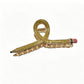 Beau hair clip in pastel pink placed next to matching accessories