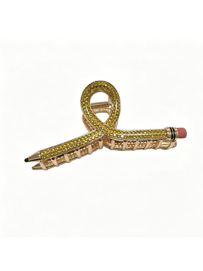 Beau hair clip in pastel pink placed next to matching accessories