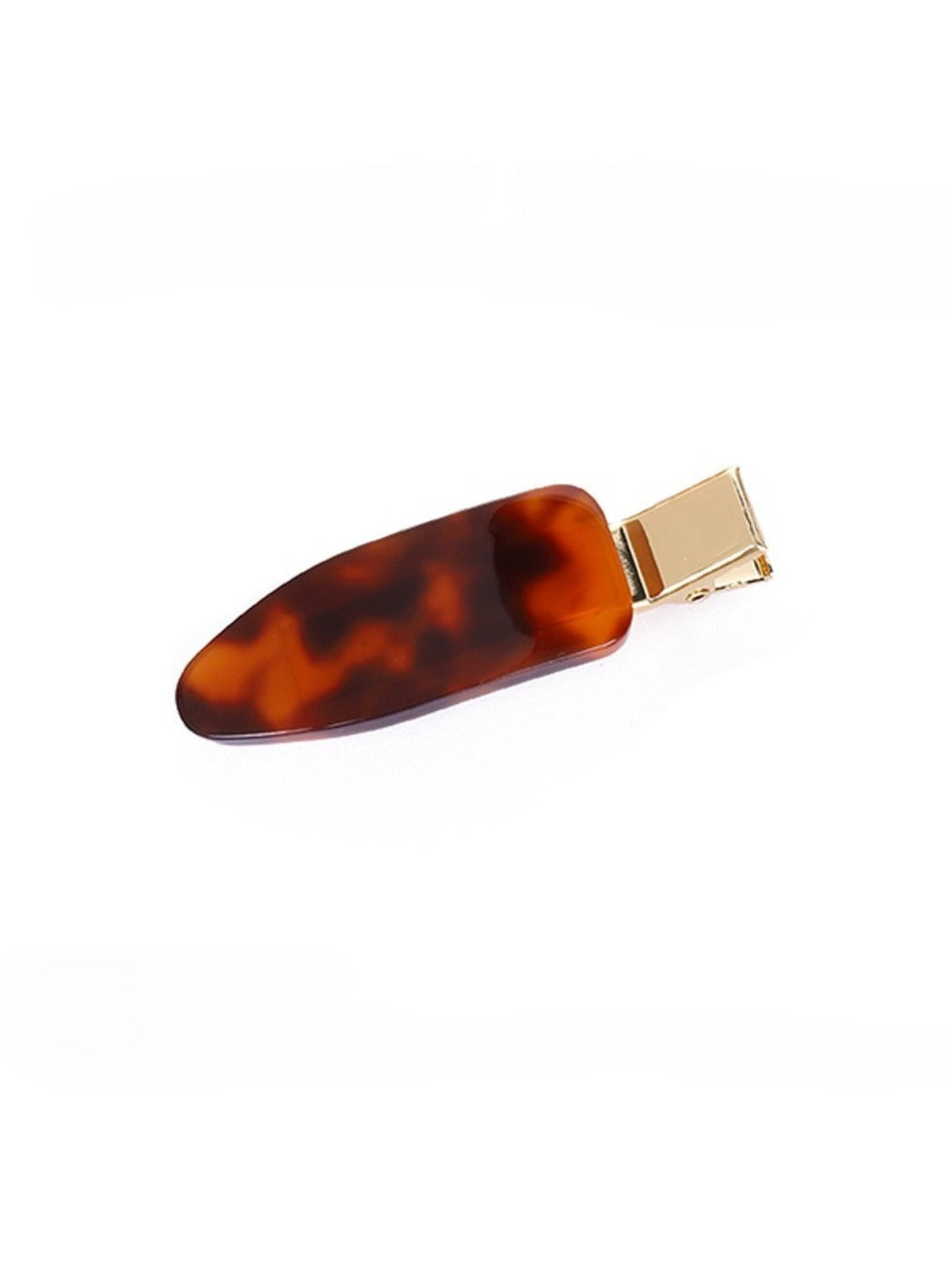 Beau vintage textured hair clip displayed with natural lighting on wooden surface