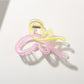 Side angle of Beau butterfly hair clip highlighting clasp mechanism