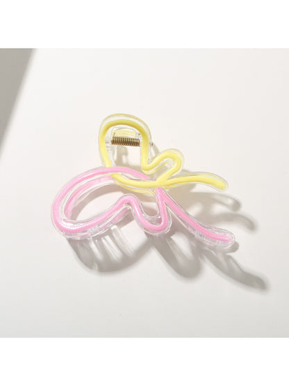 Side angle of Beau butterfly hair clip highlighting clasp mechanism