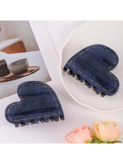 Close-up of Beau hair clip highlighting heart pattern and metal clasp