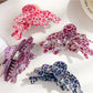 Side view of Beau butterfly claw clip with leopard print design
