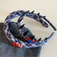 Close-up of blue scrunchie showing fabric texture and elastic band