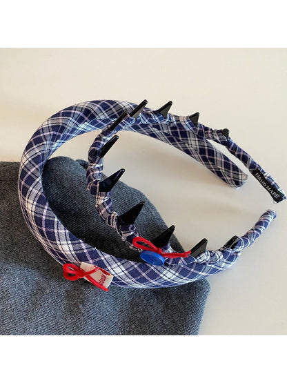 Close-up of blue scrunchie showing fabric texture and elastic band