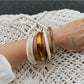 Side view of Lovra vintage ombre bangle bracelet displaying curved design