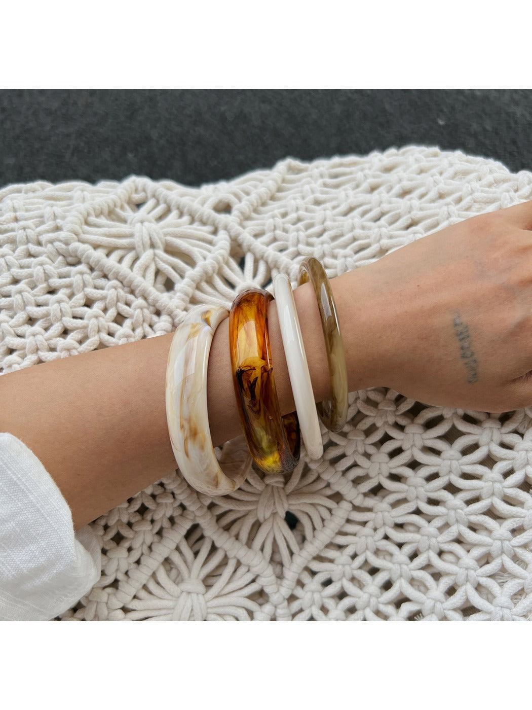 Side view of Lovra vintage ombre bangle bracelet displaying curved design
