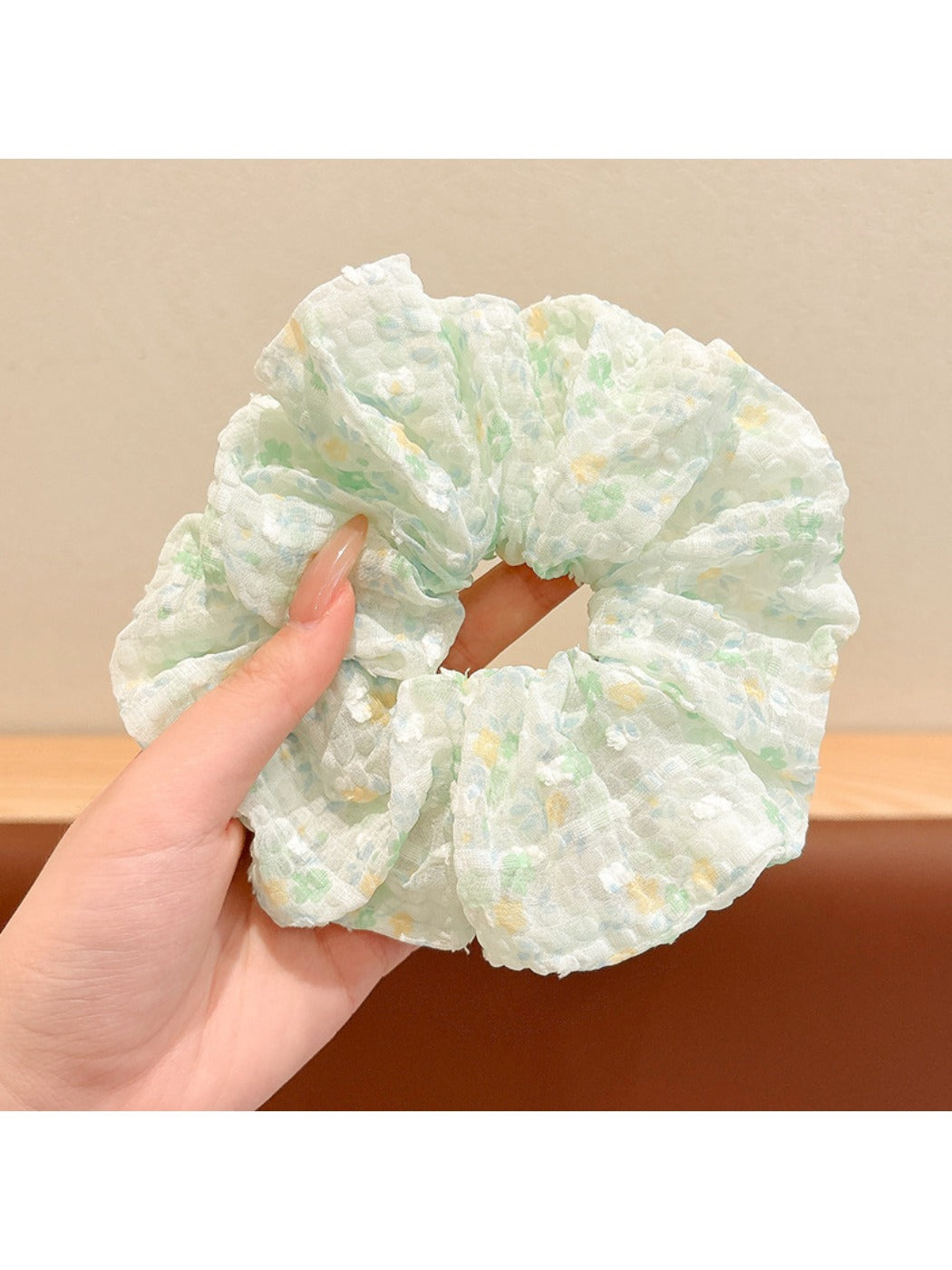 Gifty floral scrunchie next to matching floral accessories