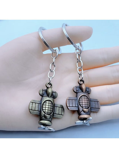 Close-up of a lifelike airplane shaped keychain with detailed wings and tail