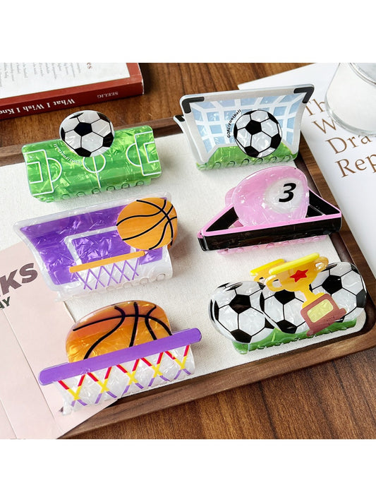 Beau claw clip shaped like a basketball with orange and black details