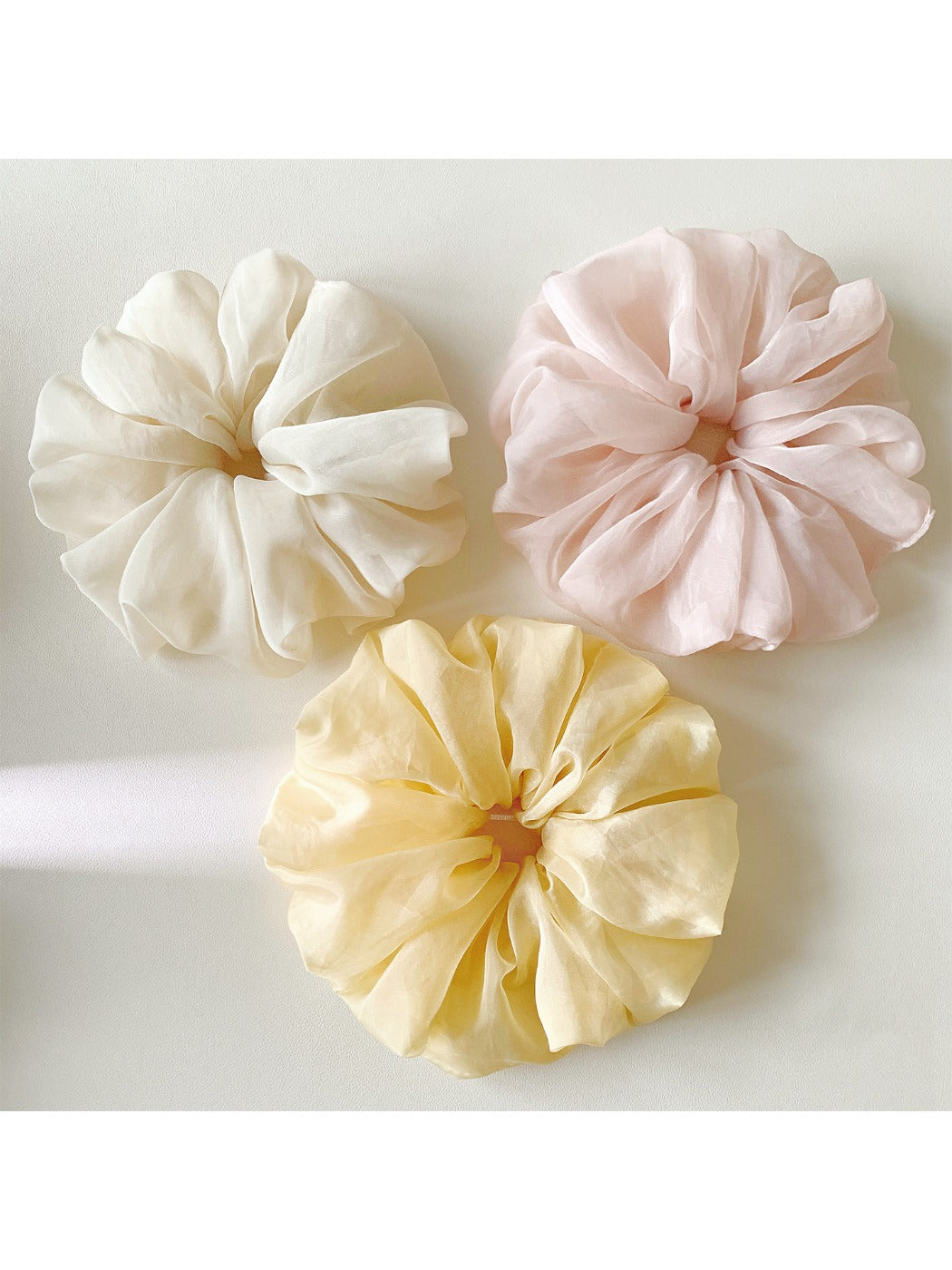 Gifty Pure Simple Mesh Scrunchie in light beige on white background