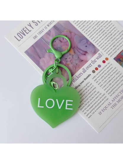 Purple heart-shaped pendant keychain displayed on a white background