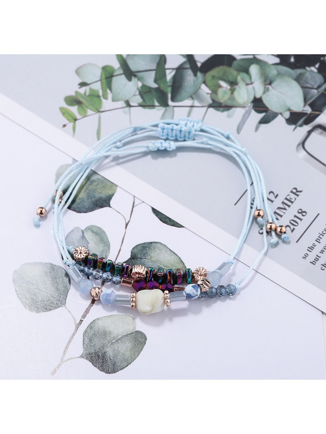 Lovra bracelet worn on wrist showcasing adjustable black woven cord and beads