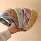 Close-up of Gifty headband showing detailed college style pattern and fabric texture