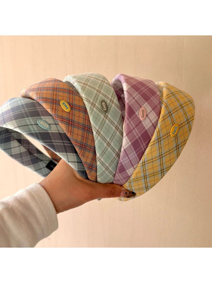 Close-up of Gifty headband showing detailed college style pattern and fabric texture