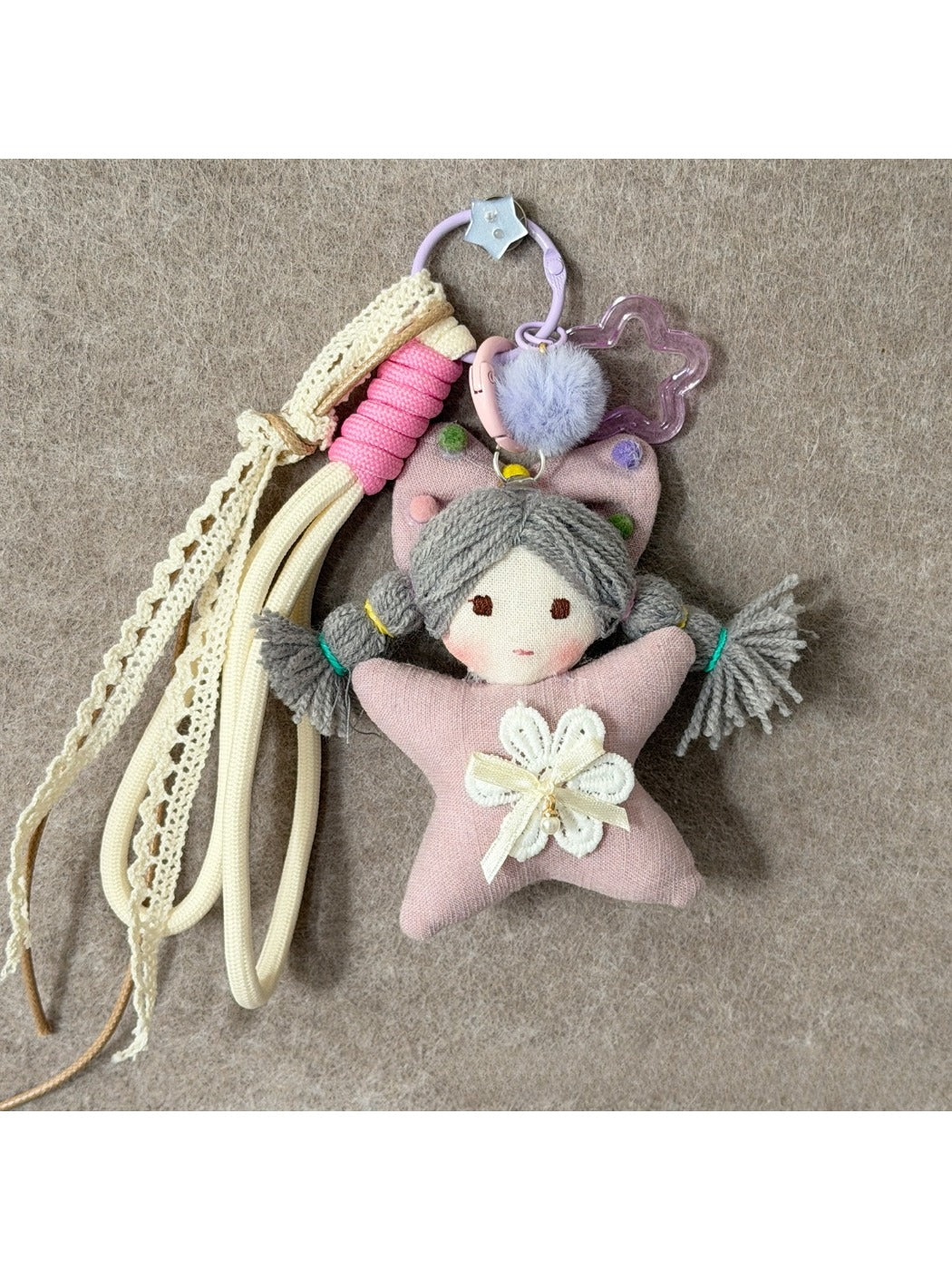 Back view of Keypus fabric cartoon doll keychain showing plain fabric surface