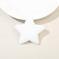 Beau star hair clip held between fingers showing size and plush material