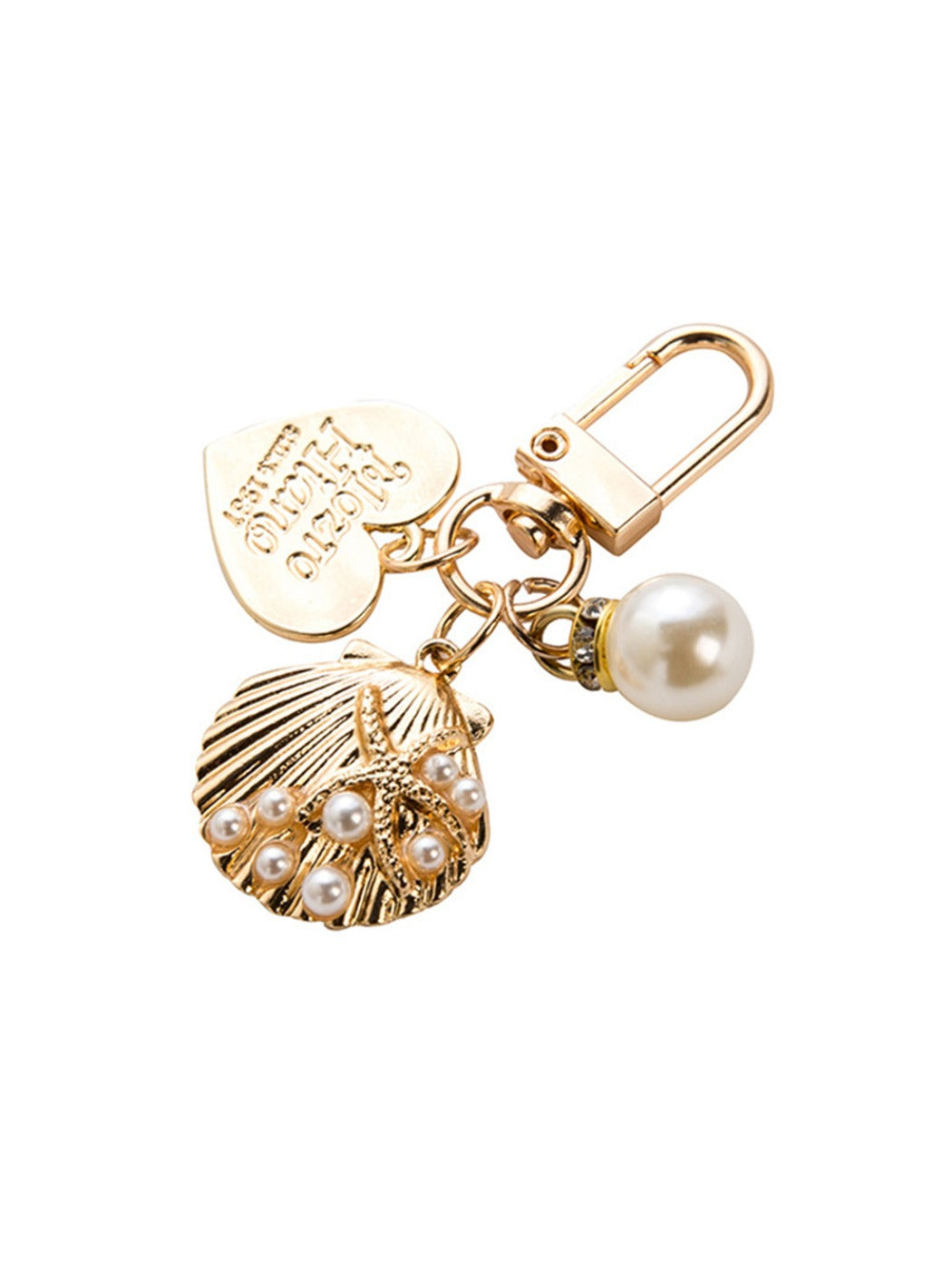 Alloy heart keychain attached to a set of keys on a wooden surface
