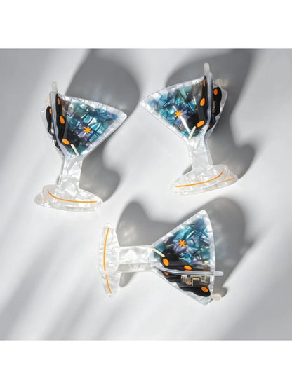 Beau goblet shaped claw clip open, displaying inner claw structure and spring