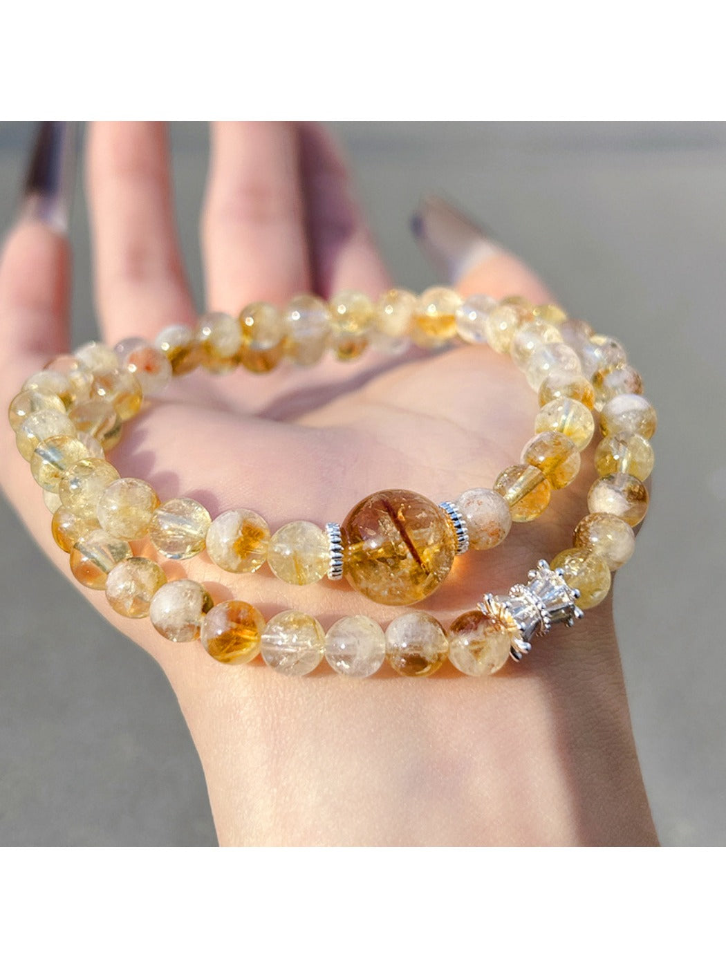 Lovra yellow crystal multi-wrap bracelet coiled with gold clasp visible