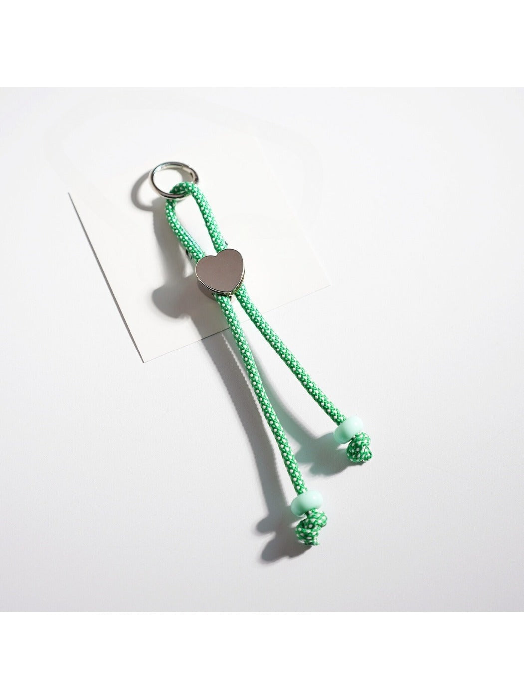 Colorful rope heart keychain attached to a silver keyring