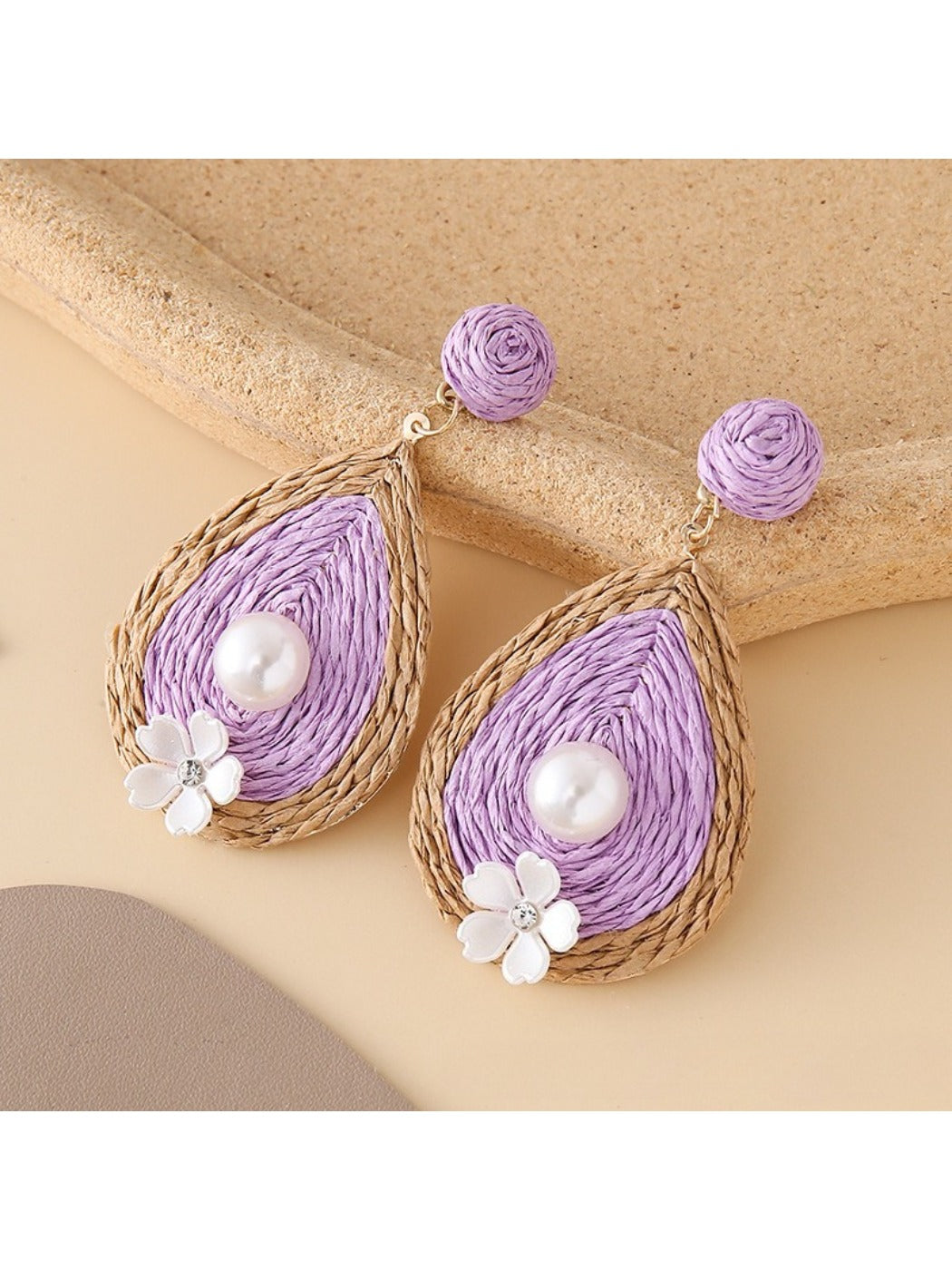Earedge chic teardrop drop earrings displayed on black velvet pad