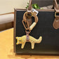 Fox charm keychain displayed with a gift box and ribbon