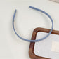 Gifty silky smooth headband styled with casual outfit on model