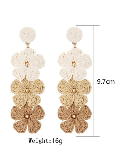 Side view of colorful Bohemian drop earrings with layered shapes and gold accents