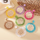 Close-up of elegant sunflower shaped drop earring with gold petals and center