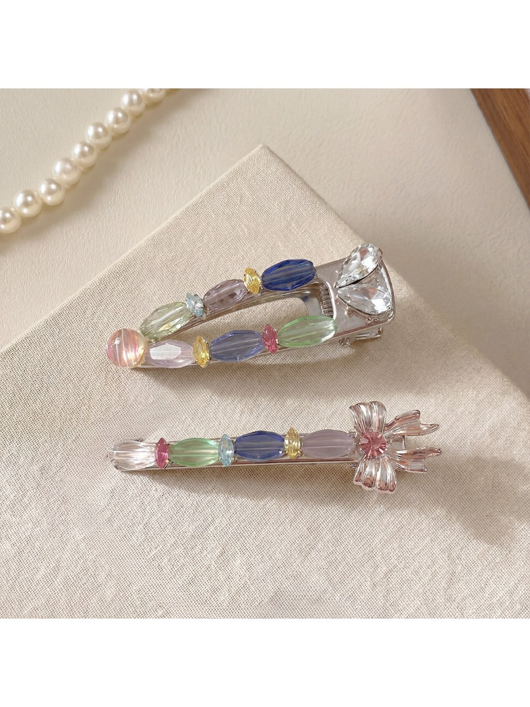Close-up of Beau colorful hair clip showing layered pastel petals and gold clip base