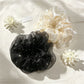 Close-up of Gifty rhinestone embellished tulle scrunchie in soft pink