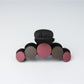 Beau hair clip shown from an angle emphasizing its curved shape