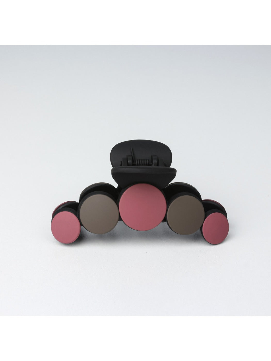 Beau hair clip shown from an angle emphasizing its curved shape