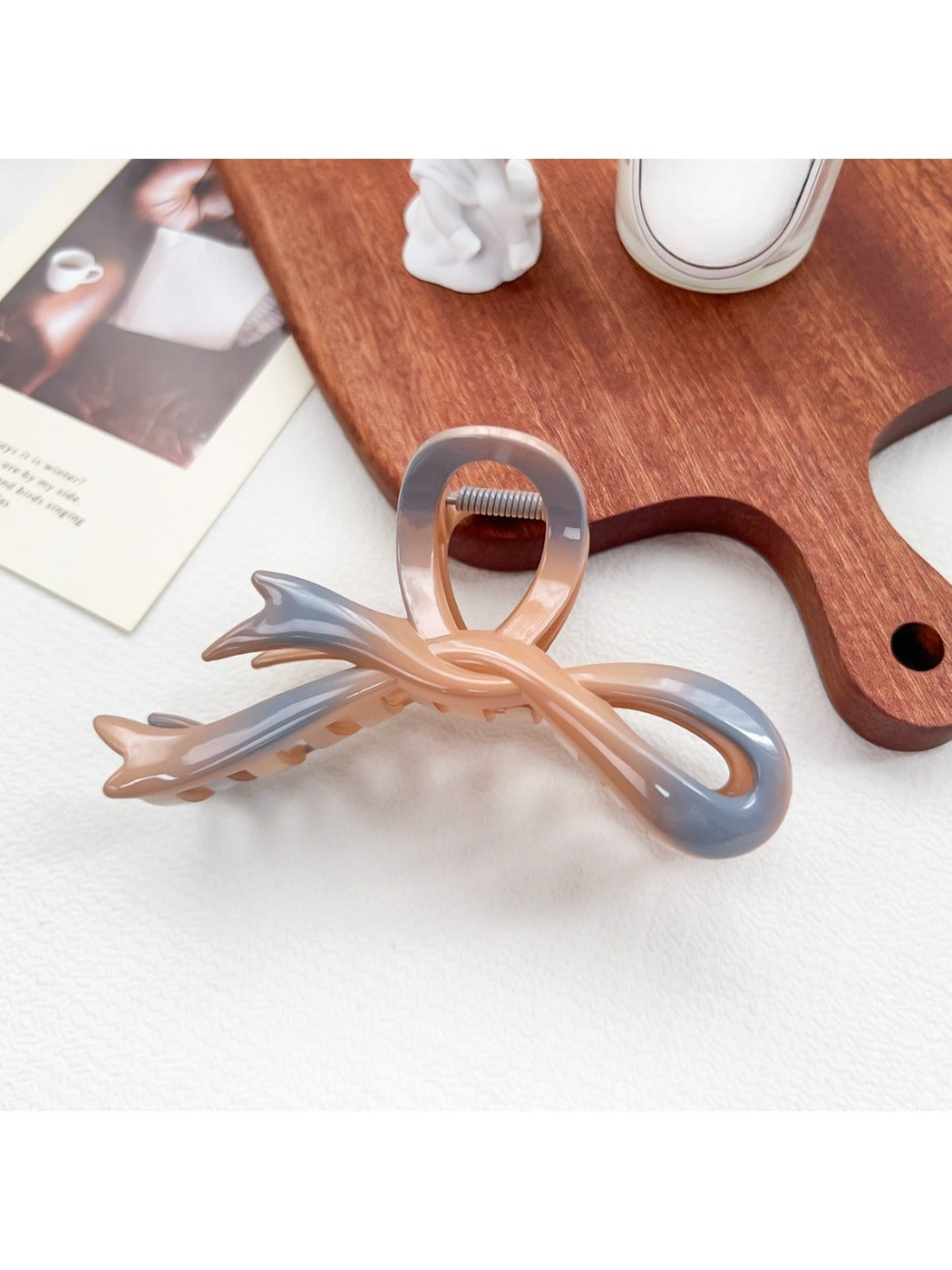 Beau ombre heart shaped bow claw clip shown from multiple angles on a rotating display