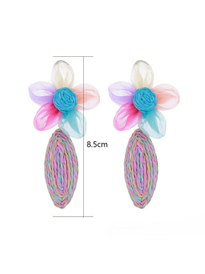 Side view of raffia lace earrings showing earring hooks and delicate flower design