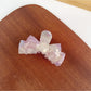 Beau hair claw clip holding thick hair in an elegant updo