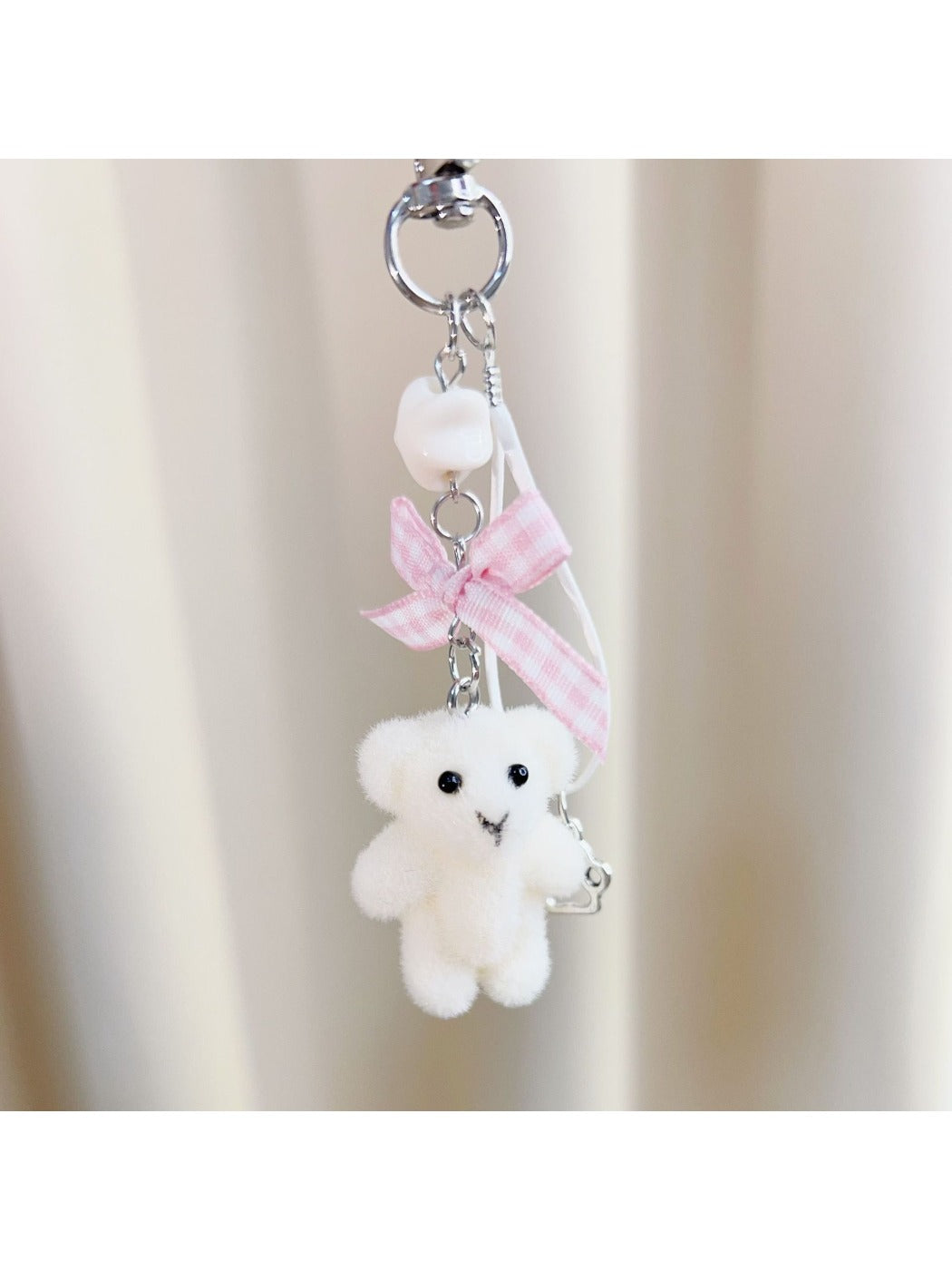 Top view of Keypus flocked bear keychain showing rounded ears and face