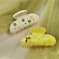 Close-up of Beau floral crescent hair claw clip showing detailed flower pattern