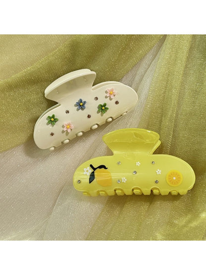 Close-up of Beau floral crescent hair claw clip showing detailed flower pattern