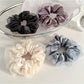 Gifty satin tulle scrunchie with ruffle trim on white background