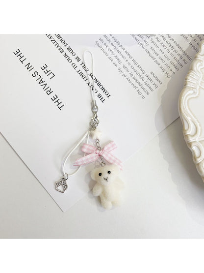 Keypus bear keychain displayed with other colorful bag charms